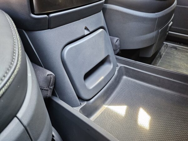 RCS Safe (sanded/painted version) installed in Rivian Camp Speaker console, in the closed position, angled view