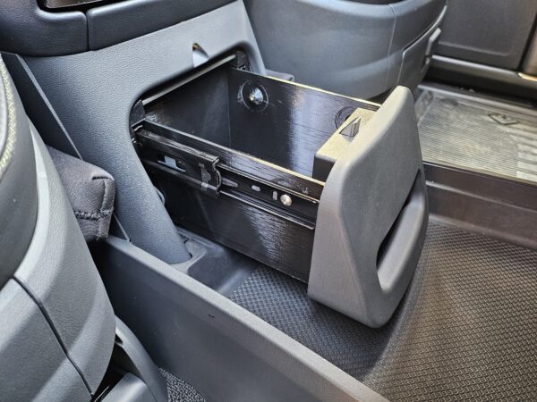 RCS Safe (sanded/painted version) installed in Rivian Camp Speaker console, in the opened position, angled view